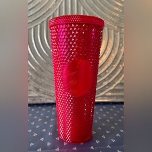 Starbucks studded pink tumbler.